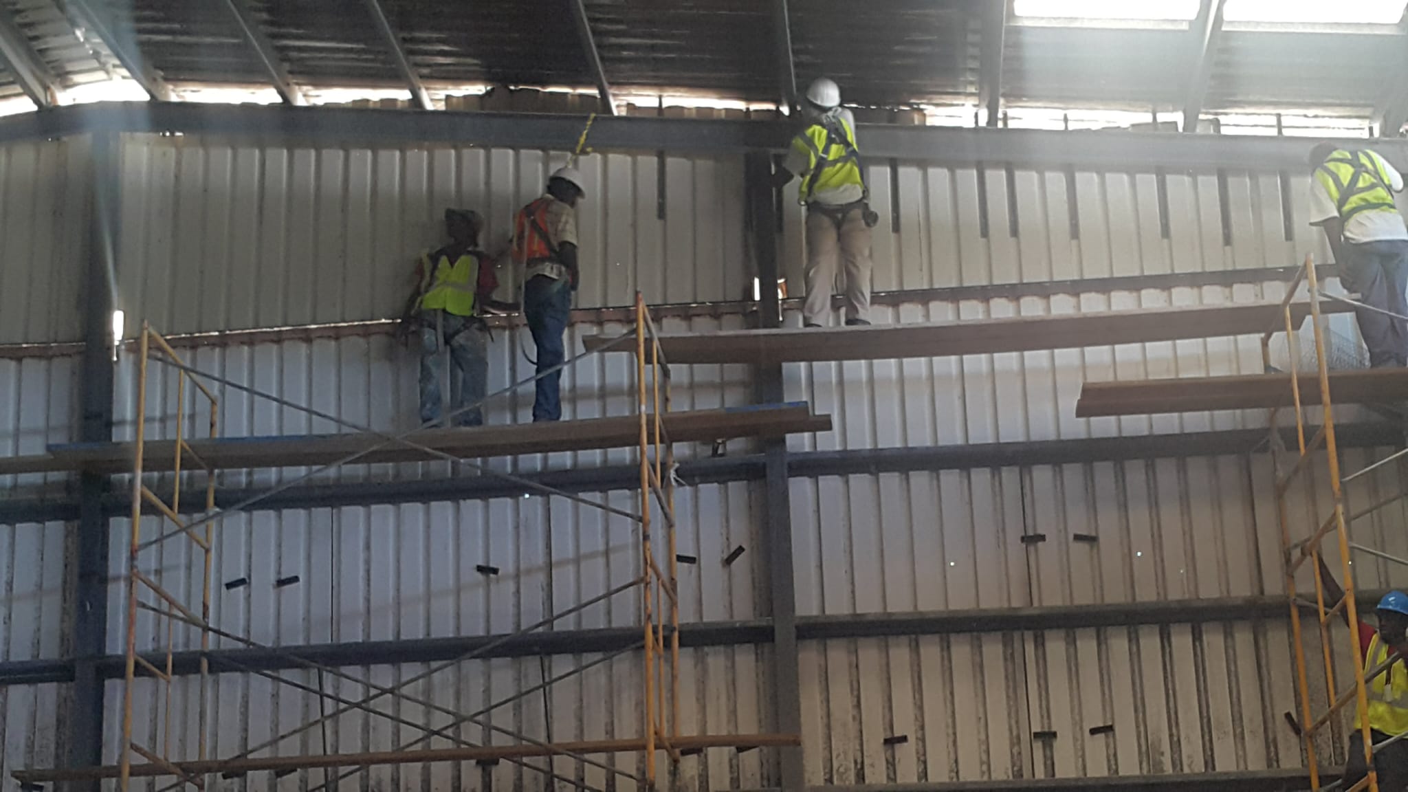 Scaffolding and structural work inside a metal building