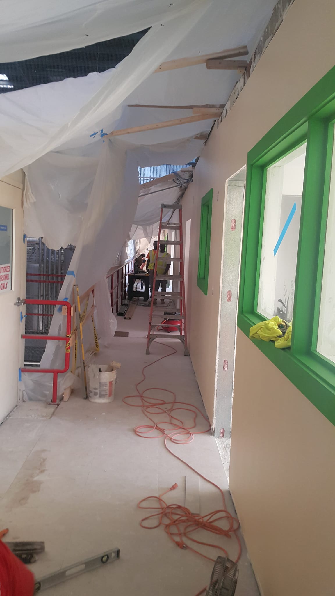 Ceiling and wall refurbishment in an interior corridor